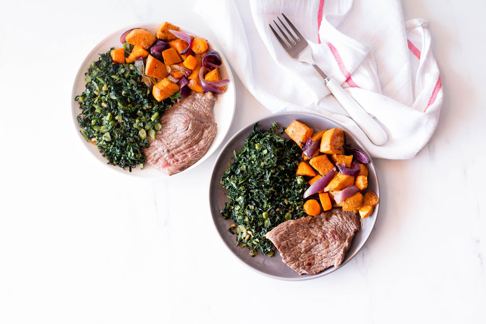This quick and easy recipe is an example of a well-rounded lunch or dinner: Grilled steaks marinated in olive oil and spices (protein/healthy fat) topped with roasted veggies (carbohydrate/veggies) and sautéed garlic kale (greens/healthy fat). https://www.spotebi.com/recipes/grilled-steak-roasted-veggies-sauteed-kale/