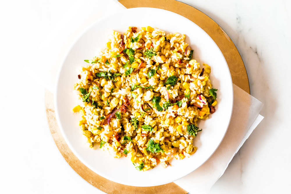 This Fried Leftover Rice with Edamame & Veggies is a clean-out-the-fridge vegan and gluten-free stir-fry that turns leftovers into a quick and easy weeknight dinner! https://www.spotebi.com/recipes/fried-leftover-rice-edamame-veggies/